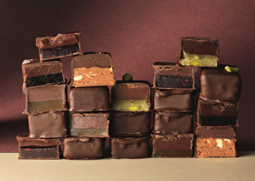 Couture Chocolare - Including, pistachio, Praline, Japanese Black Vinegar, Apricot & Wasabi, Juniper & Cassis and Raspberry.